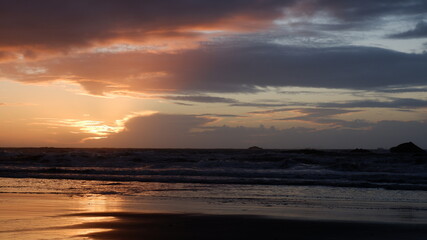 Cloudy sunset over the mountains and sea