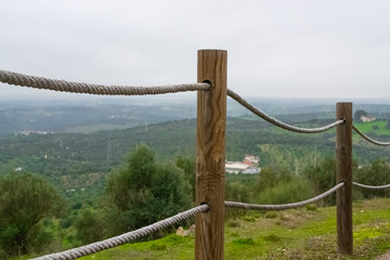 Rustic style fence made of posts and ropes