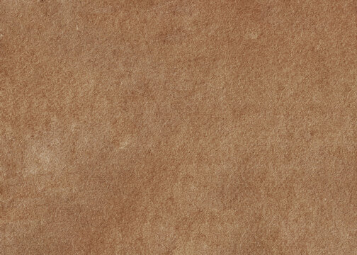 Paper texture cardboard background close-up. Deep brown and grunge old paper surface texture.