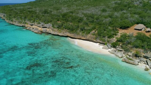 Remote Cove in the Caribbean with crystal clear water and coral reef