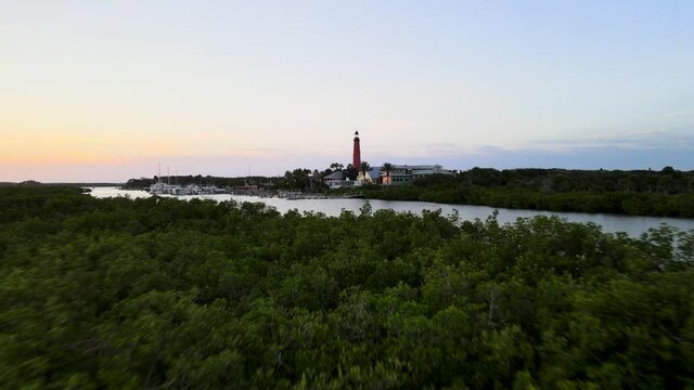 Cinematic pull back shot of Ponce Inlet Lighthouse in Florida