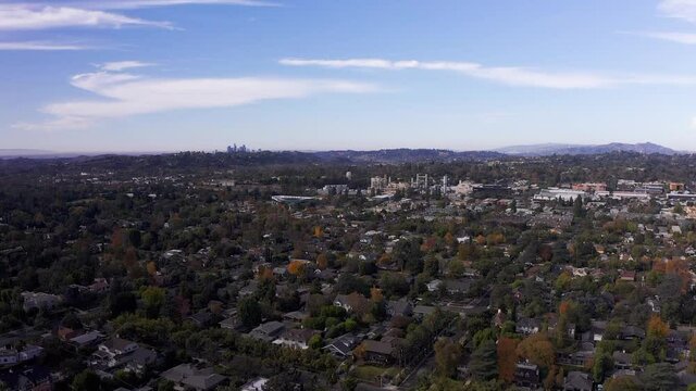 Wide aerial shot of Pasadena with Downtown Los Angeles in the distance. HD at 60 FPS.
