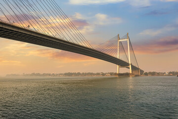 Fototapeta na wymiar Cable stayed bridge known as Vidyasagar Setu on river Ganges at sunset at Kolkata, India