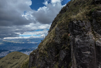 person climbing in the mountain
