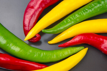 yellow, red and green hot chili on a plate. Pepper. Vegetable vitamin food.