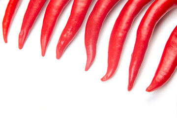 Red hot chili peppers on a white background. food figures. Vitamin vegetable food