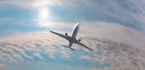White passenger airplane over the clouds  - Travel by air transport