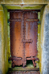 rusty metal door at fort canby