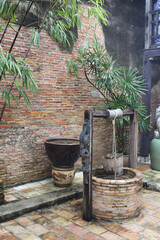 Outdoor antique stone artesian aquifer, underground water supply resources, fountain backgrounds