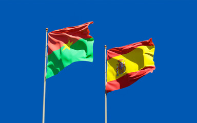 Flags of Spain and Burkina Faso.