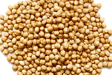 Raw, uncooked chickpeas isolated on a white background. Top view