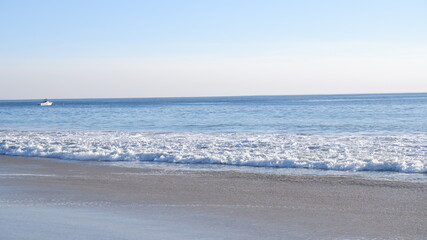 Sunlights, beach and ocean waves