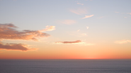 Naklejka na ściany i meble Pacific ocean and sunset