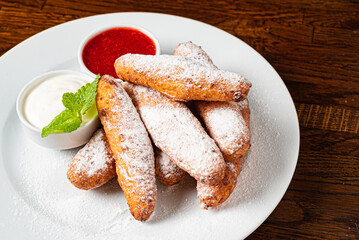 deep fried donuts with berry sauce