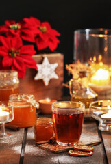 Glass of Christmas tea with cloves and cinnamon.