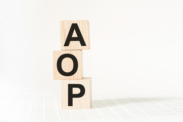 wooden cubes with text AOP . the medicine. medical concept