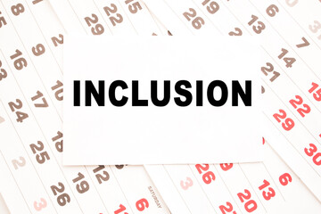 text INCLUSION on a sheet from Notepad.a digital background. business concept . business and Finance.