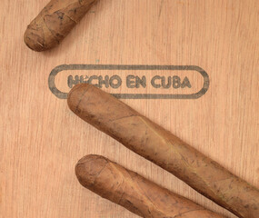 Cuban handmade cigars on cedar box with text on spanish "Made in Cuba"