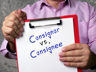 Business concept meaning Consignor vs. Consignee with phrase on the piece of paper.