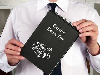 Business concept meaning Capital Gains Tax with phrase on the piece of paper.
