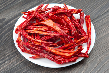 red dried hot peppers on a plate