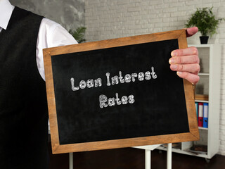 Business concept about Loan Interest Rates with sign on the piece of paper.
