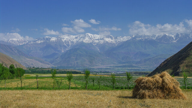 Stunning countryside view of the snow-capped Academy of Sciences mountain range near Garm in the Rasht valley, Tajikistan