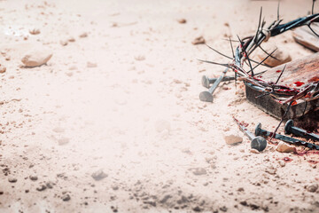 Good Friday, Passion of Jesus Christ. Crown of thorns, hammer, bloody nails on ground. Christian...