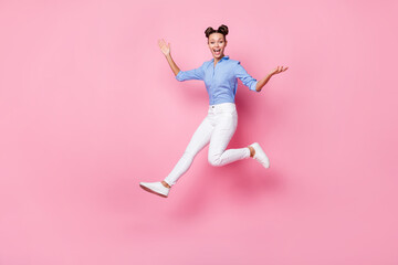 Fototapeta na wymiar Full length body size photo of jumping crazy girl wearing casual clothes laughing isolated on pastel pink color background
