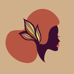 Hair salon and beauty studio logo.Beautiful African woman with elegant, Afro hairstyle and lipstick.Young lady.Hairdresser and cosmetics logo.Luxury,glamour portrait.Female head.Decorative flower.