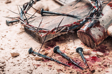 Old wooden cross, hammer, bloody nails and crown of thorns on ground. Banner. Copy space. Good friday. Passion, crucifixion of Jesus Christ. Christian Easter holiday. Gospel, salvation - 401486661