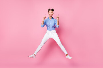 Full length body size photo of creative girl jumping smiling pointing up finger got idea isolated...