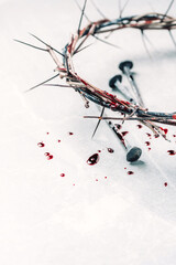 Bloody nails, crown of thorns, drops of blood on grey stone background. Good Friday, Passion of...
