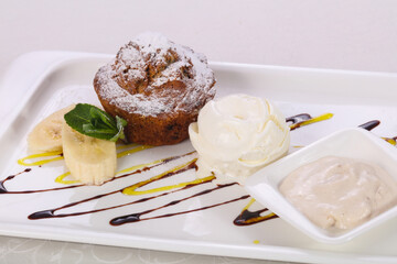 Tasty hot muffin with ice cream