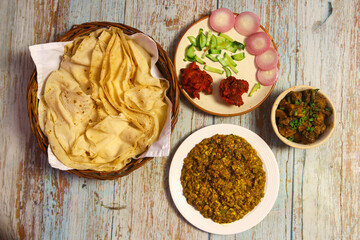 Rumali roti, daal tadka, chicken kosha and chicken pakoda with salad
