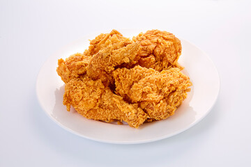 crispy fried chicken in white dish on white table