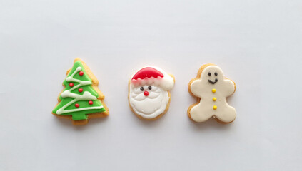 Christmas icon decoration on butter cookies on white background