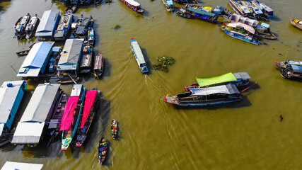 Aerial view of Cai Rang floating market, Can Tho, Vietnam. Cai Rang is famous market in mekong delta, Vietnam. Tourists, people buy and sell food, vegetable, fruits on boat, ship