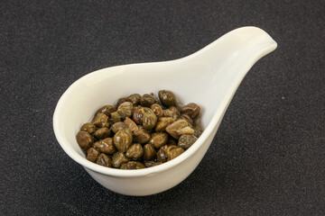 Tasty capers in the bowl