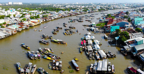 Aerial view of Cai Rang floating market, Can Tho, Vietnam. Cai Rang is famous market in mekong delta, Vietnam. Tourists, people buy and sell food, vegetable, fruits on boat, ship