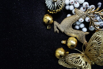 Christmas balls and Elk Christmas ornaments with space copy on black glitter background