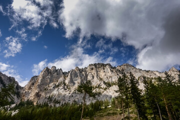 Obraz premium beautiful mountains with white clouds on the blue sky