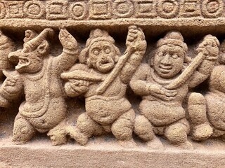 Hindu God deity statue. Ancient sandstone carved historical Hindu God sculptures in the temple walls.