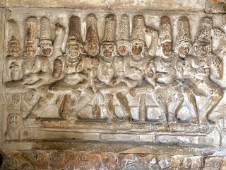 Hindu God deity statue. Ancient sandstone carved historical Hindu God sculptures in the temple walls.