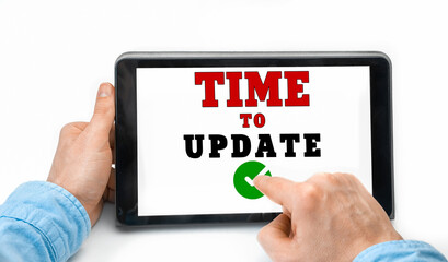 Closeup of a male hands holding tablet pc with text Time to Update
