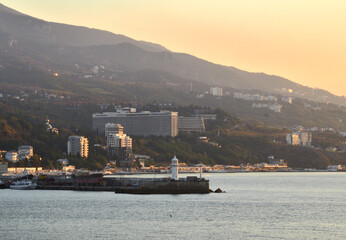 Fototapeta premium Lighthouse on the pier of the sea station in Yalta-the capital of the southern coast of Crimea