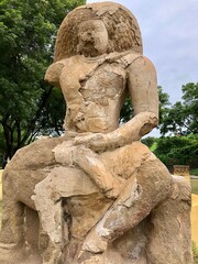 Fototapeta premium Hindu God deity statue. Ancient sandstone carved historical Hindu God sculptures in the temple walls.