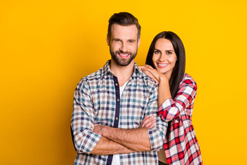 Portrait of attractive cheerful cute couple folded arms trust idyllic isolated over bright yellow color background