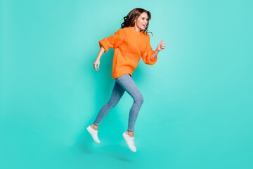 Fototapeta na wymiar Full size profile side photo of young attractive beautiful girl running in air look copyspace isolated on turquoise color background