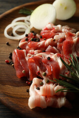 Concept of tasty snack with bacon on wooden background